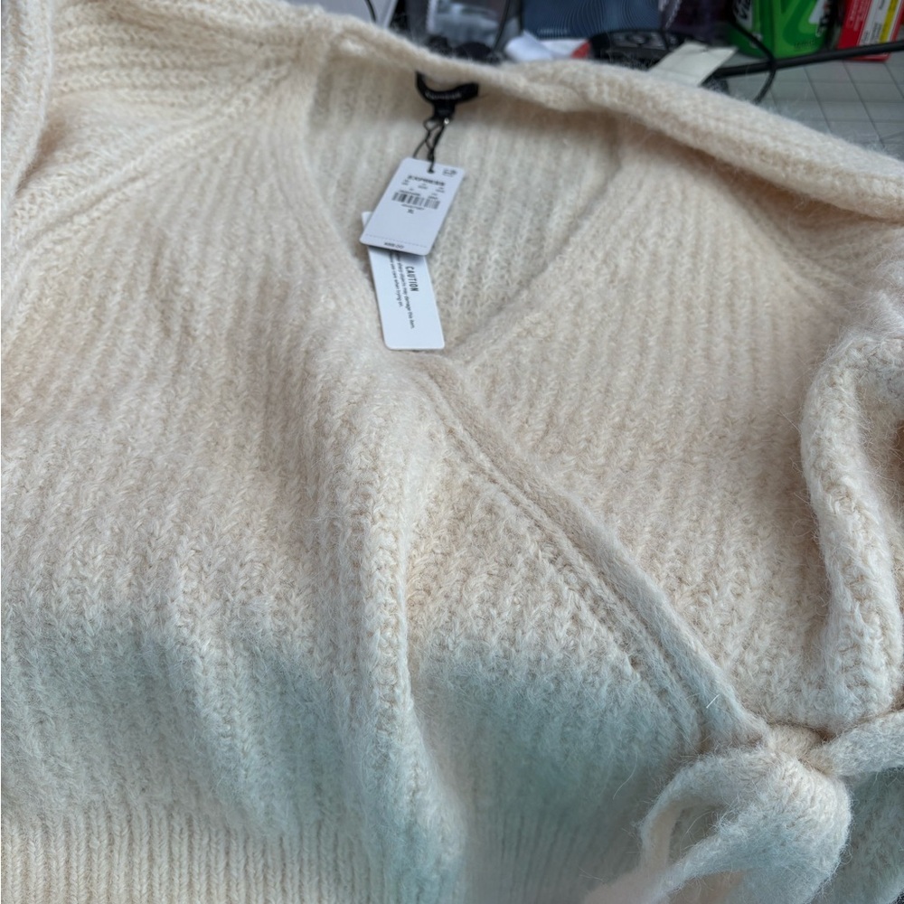 Express XL soft sweaters, one cream color and one light pink.